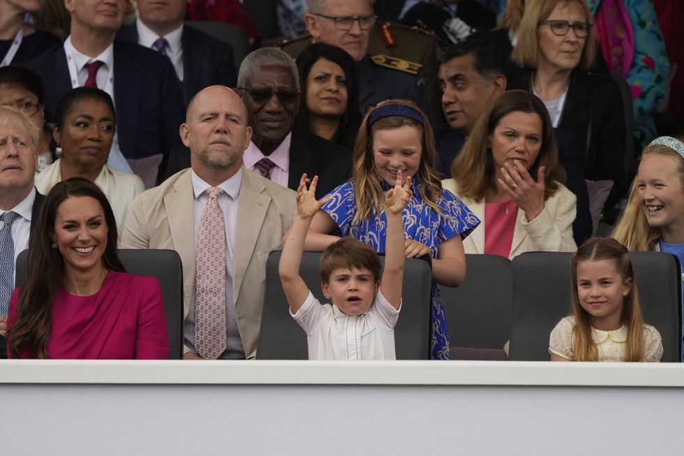 (front row. left to right) the Duchess of Cambridge, Prince Louis, and Princess Charlotte, (second row, left to right) Prime Minister Boris Johnson, Mike Tindall, Lena Tindall and Mia Tindall, during the Platinum Jubilee Pageant in front of Buckingham Palace, London, on day four of the Platinum Jubilee celebrations. Picture date: Sunday June 5, 2022.