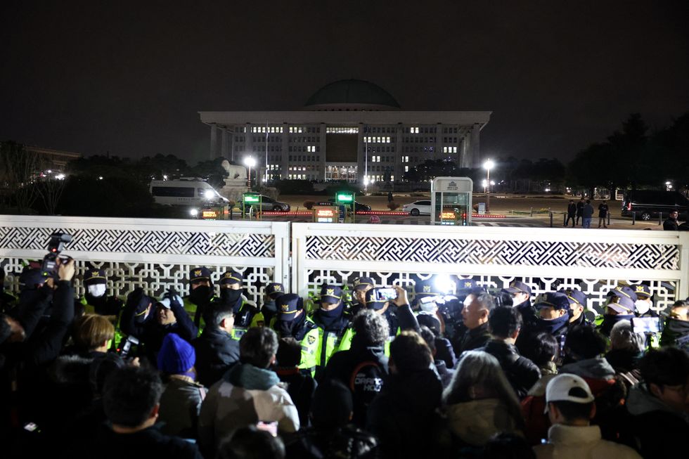 Furious crowds storm the South Korean National Assembly