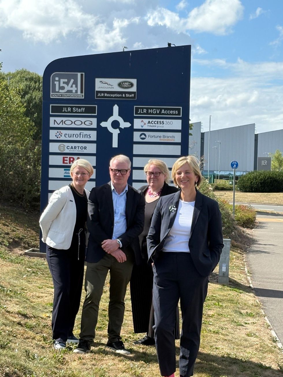 Future of Roads Minister Lilian Greenwood with West Midlands Mayor Richard Parker, National Highways' Nicola Bell, and Sarah Spink of Midlands Connect by the sign for the i54 business park close to the site of the new link road