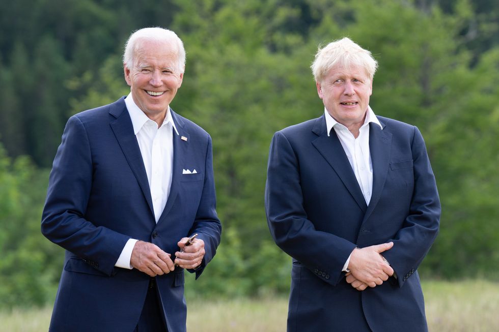 G7 leaders US President Joe Biden and Prime Minister Boris Johnson pose for the family photo during the G7 summit