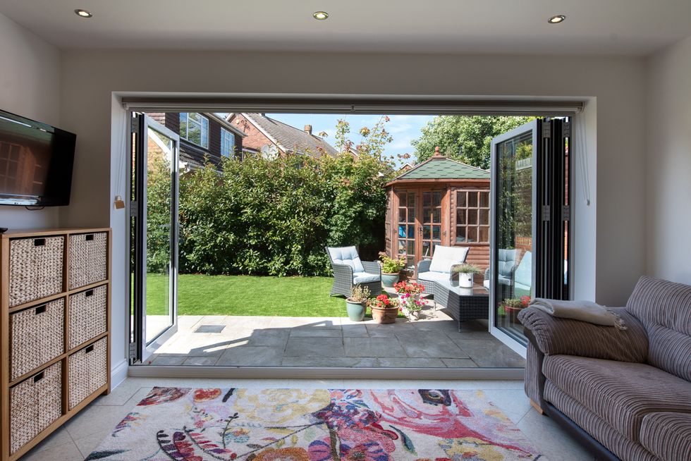 Garden room with TV and sofa