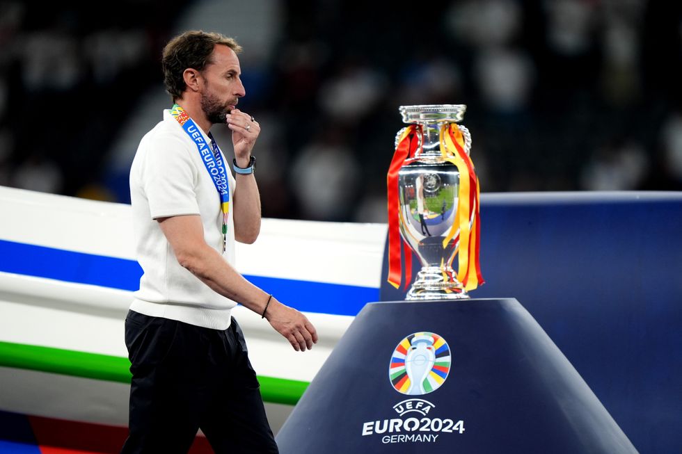 Gareth Southgate walks past UEFA Euro 2024 trophy after England defeat against Spain