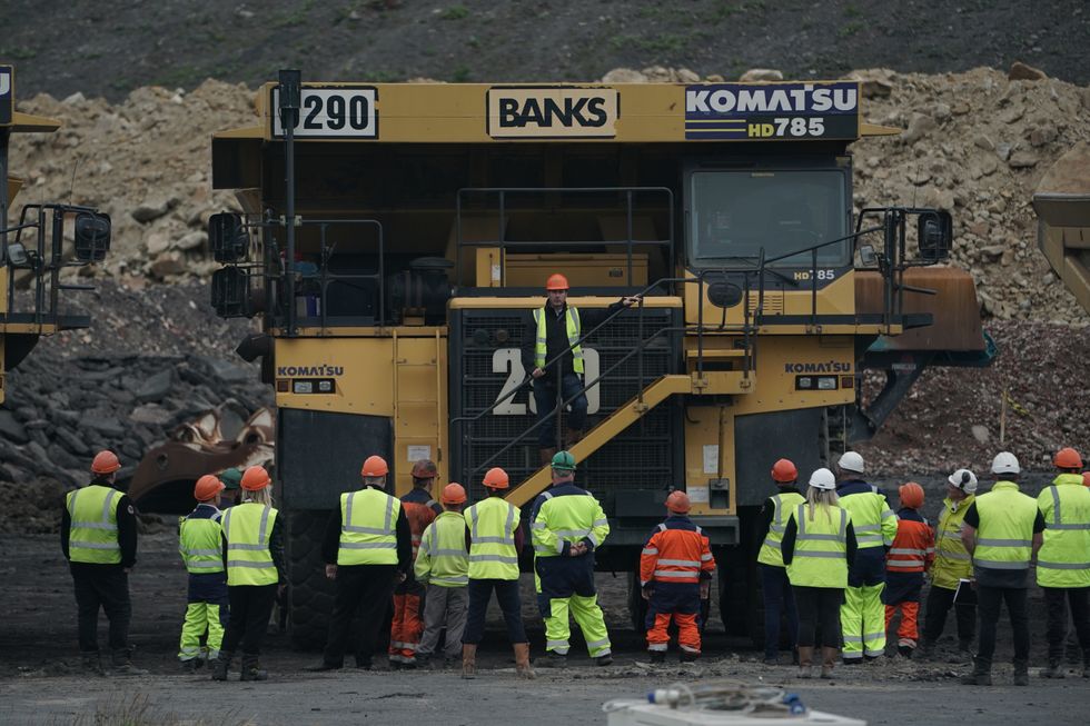 Gavin Styles, Managing Director of Banks Mining, stands on the steps of a 100ton dump truck, holding a meeting with miners at Brenkley Lane Surface Mine, Newcastle.