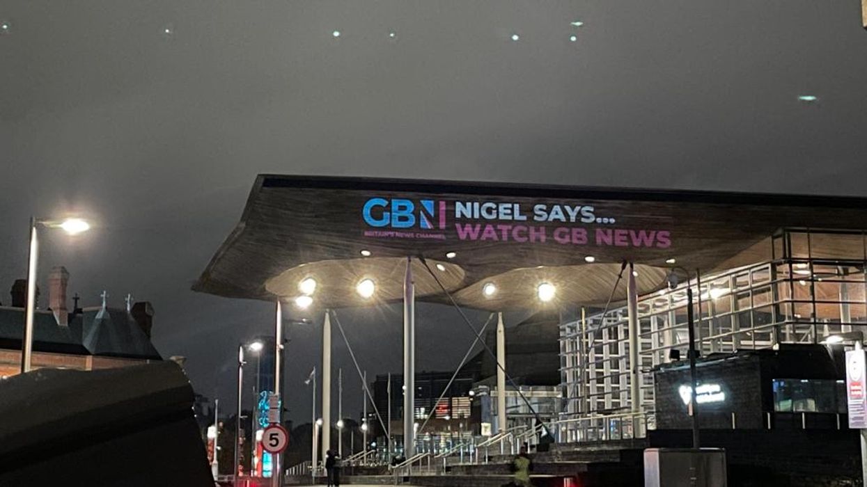 GB News has projected a message onto the Welsh Parliament