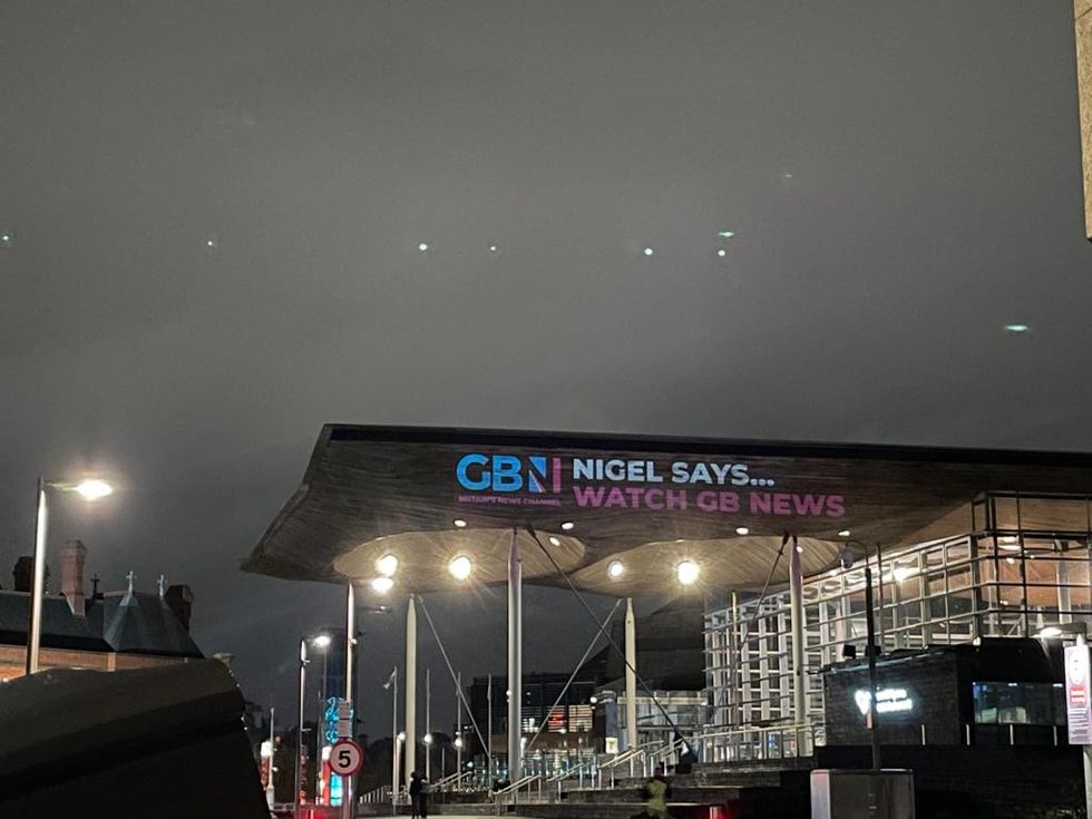 GB News has projected a message onto the Welsh Parliament