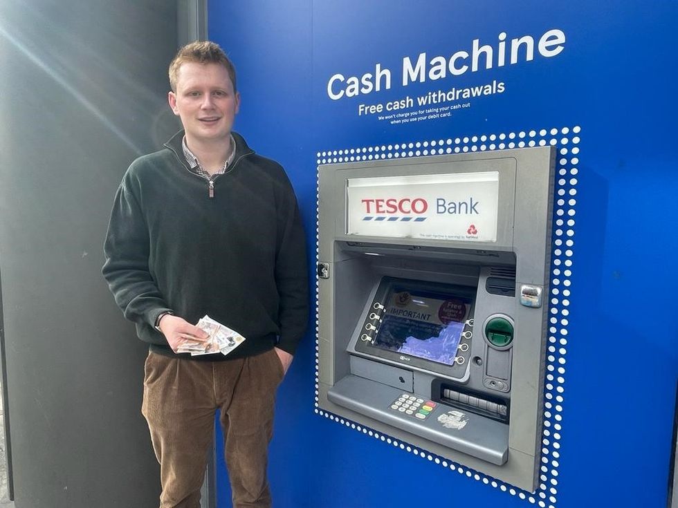 GB News' Jack Walters withdrawing cash from a Tesco ATM