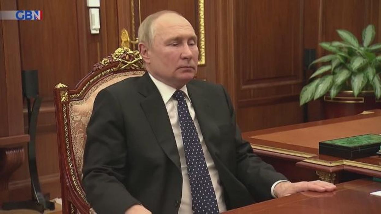 Vladimir Putin 'twisted from pain as he grabs table with hand' after latest health rumours