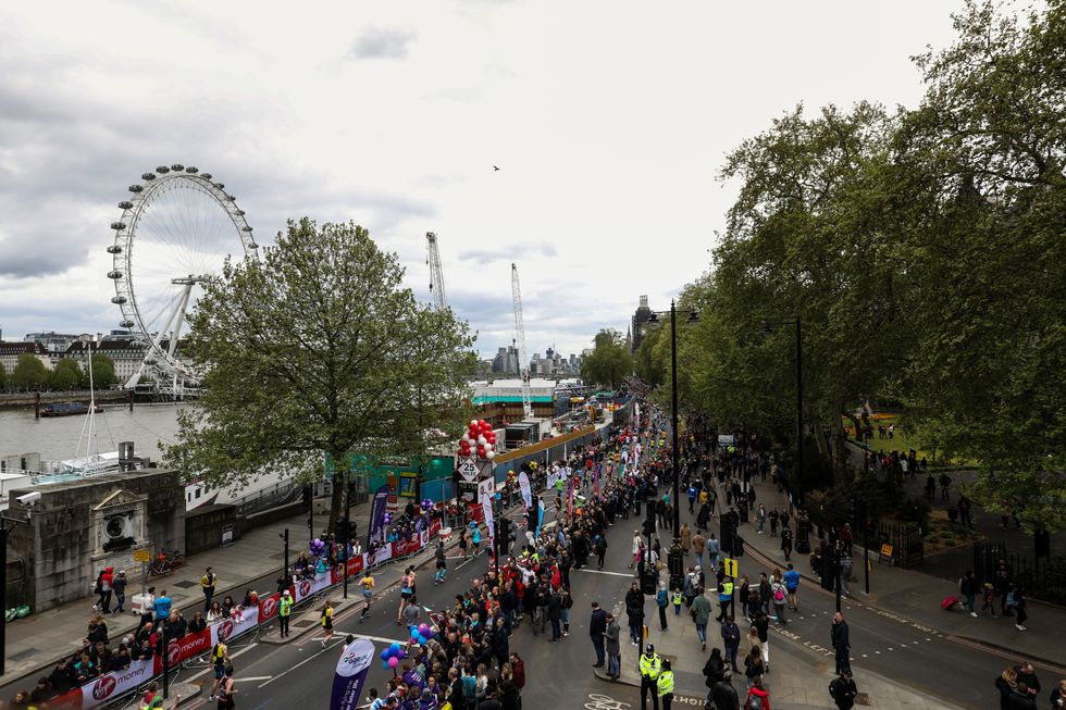 General view of runners as they pass the London Eye during the 2019 Virgin Money London Marathon.