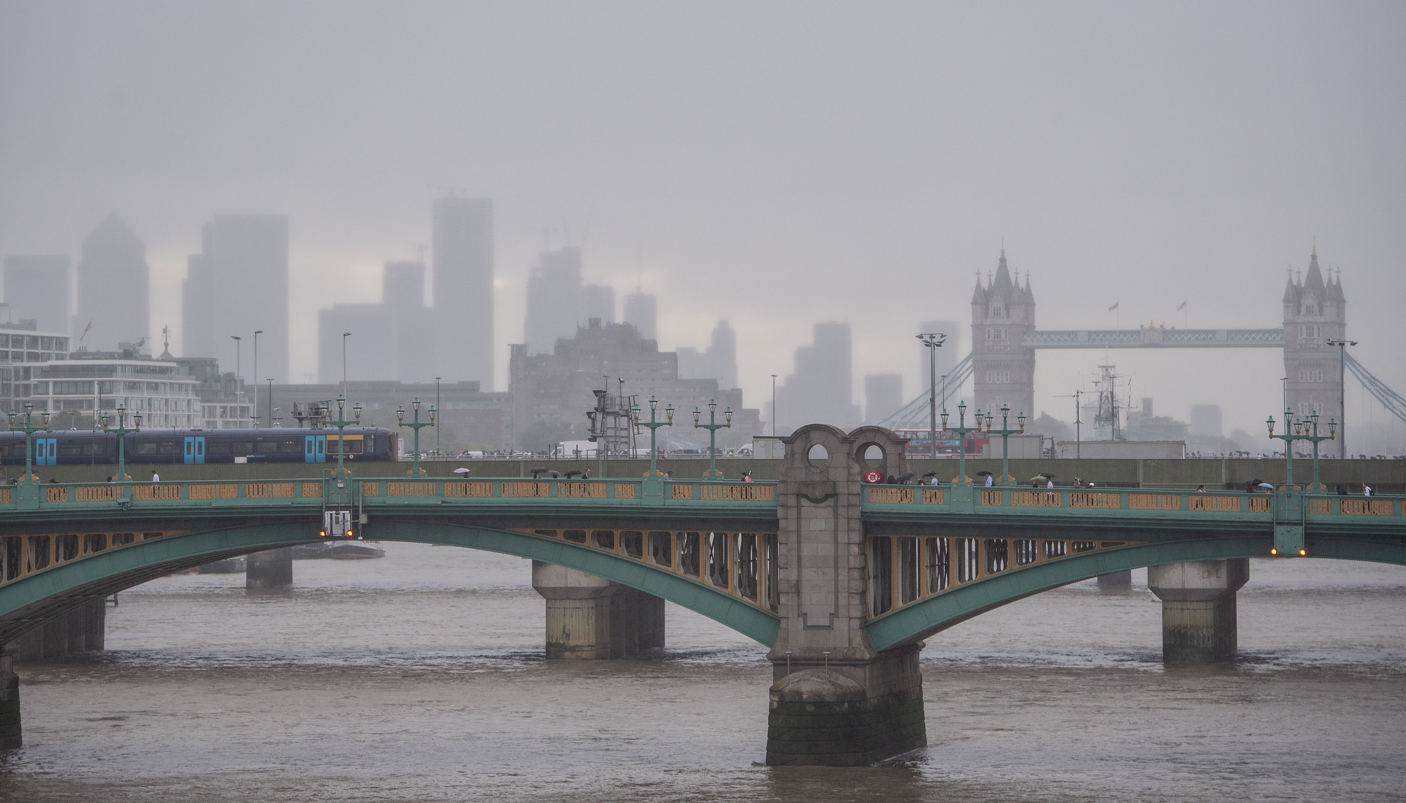 General view of Southwark Bridge, Tower Bridge and Canary Wharf in London
