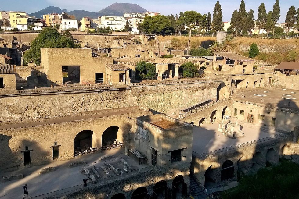 General view of the archaeological site of Herculaneum with Mount Vesuvius visible in the background