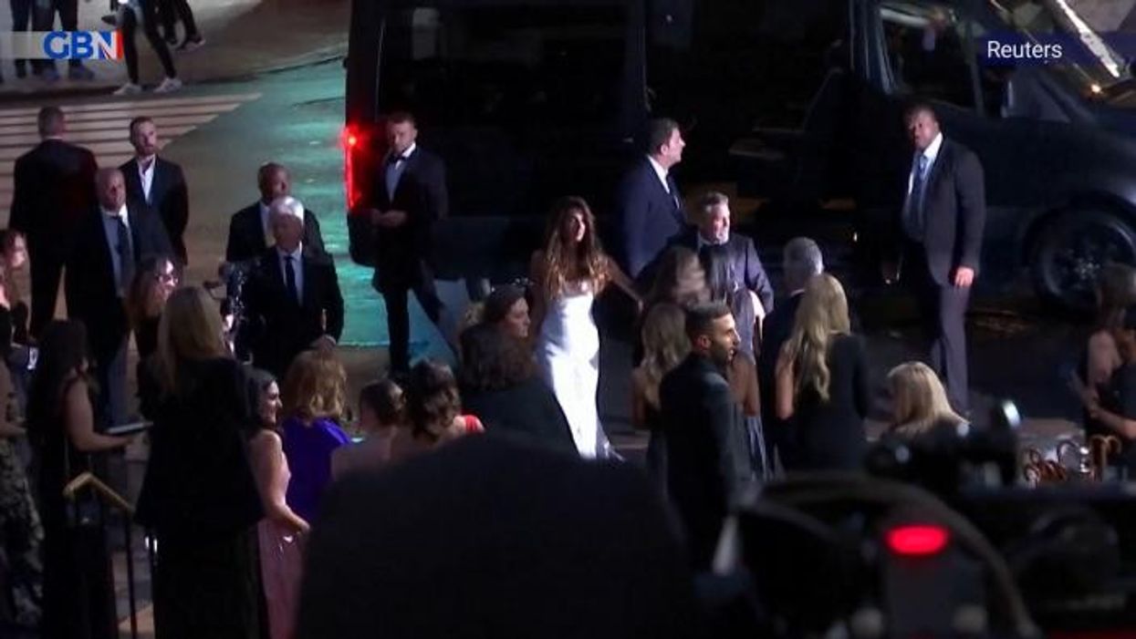 Amal Clooney oozes glamour in bespoke Versace dress at event with husband George