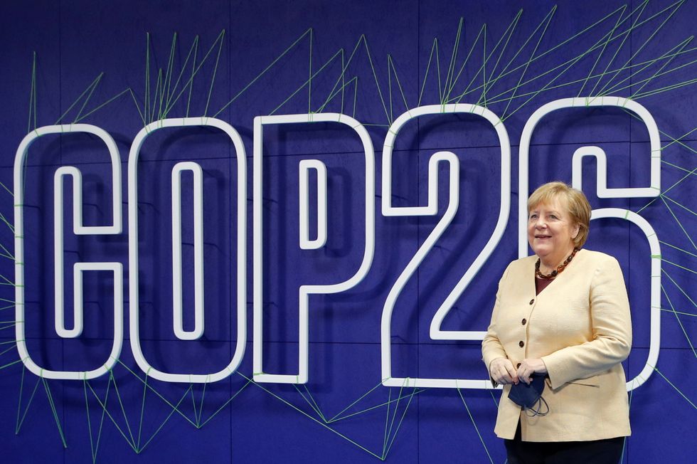 Germany's acting Chancellor Angela Merkel arrives for the Cop26 summit