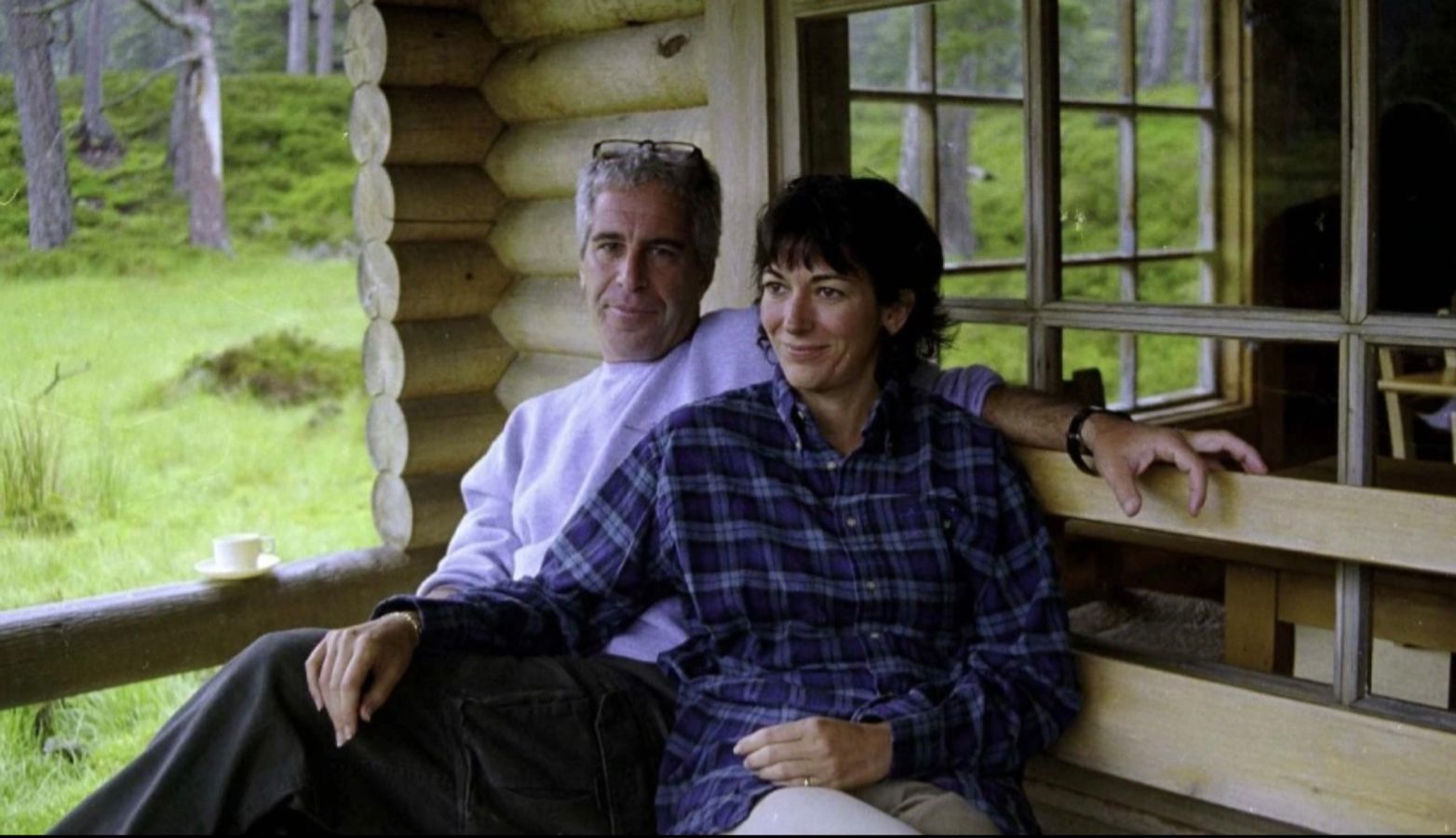 Ghislaine Maxwell and Jeffrey Epstein lounging in the Queen's log cabin at Balmoral.