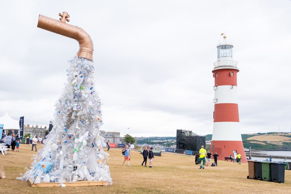 Giant Plastic Tap by artist and activist Benjamin Von Wong which is a giant tap sculpture spewing out single-use plastic waste to raise awareness of the root cause of the plastic problem: Plastic production, during the Great Britain Sail Grand Prix in Plymouth. Picture date: Saturday July 30, 2022.