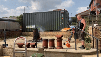 Gif of Ian Claughton using a flame thrower