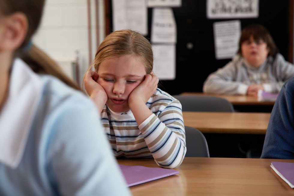 Girl falling asleep in classroom