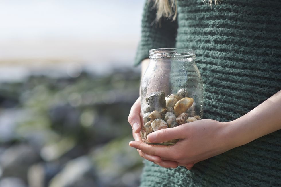 girl holding pebbles