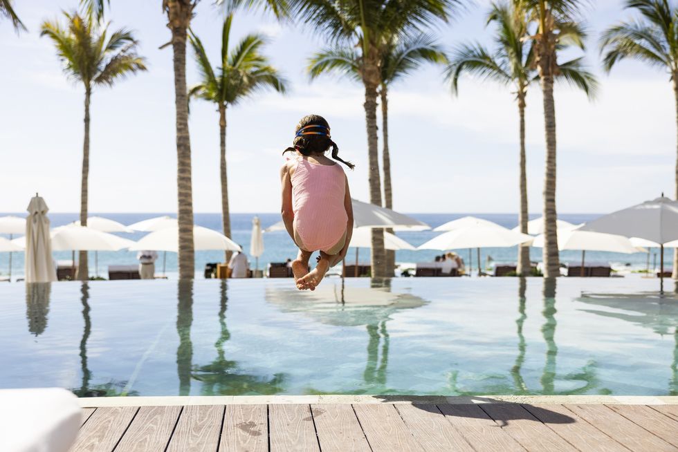 Girl jumping in pool
