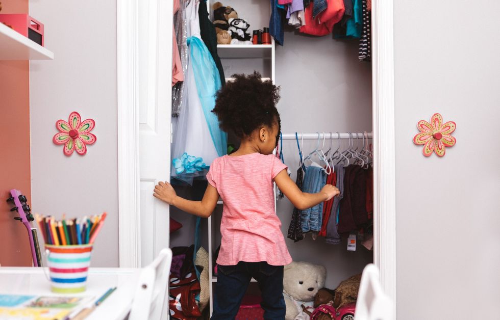 Girl looking in wardrobe