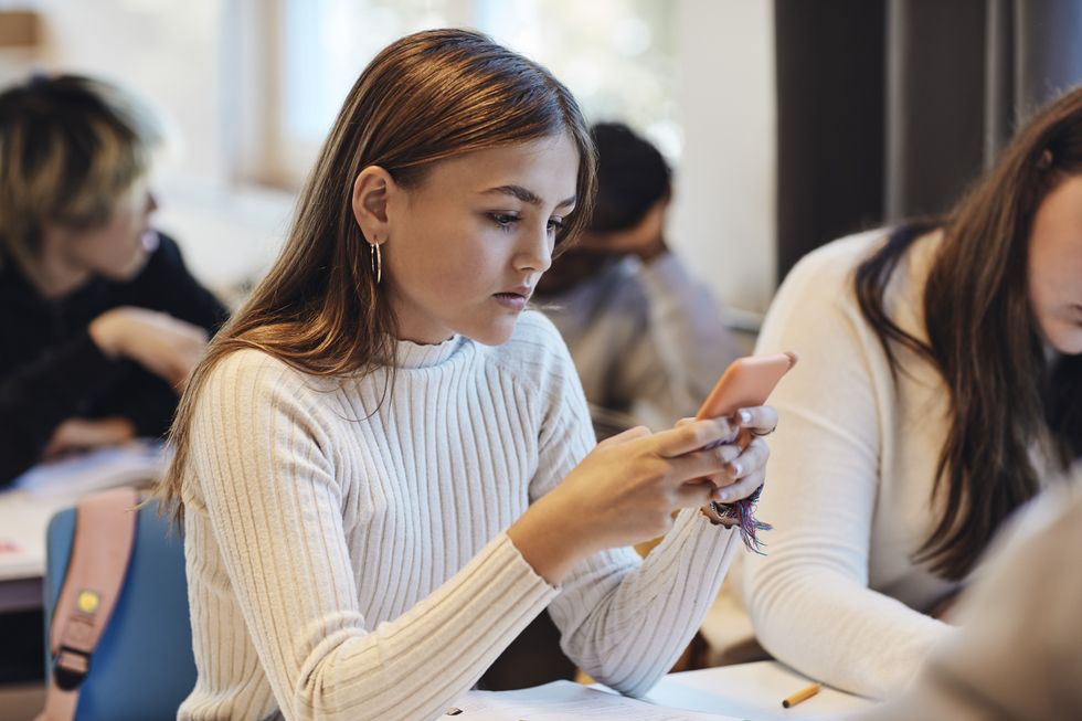 Girl on her phone in classroom