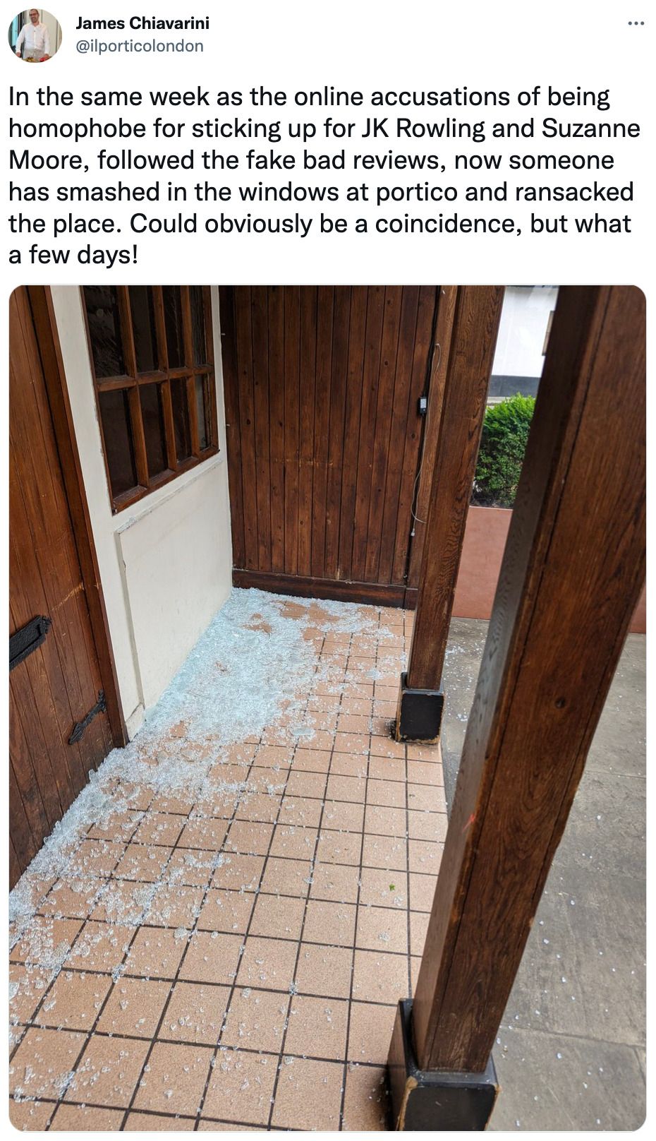 Glass from Il Portico's smashed windows cover the floor outside the venue