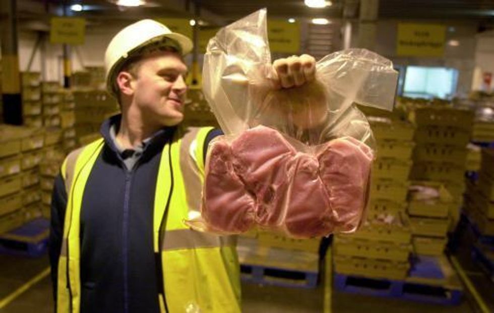 Glenn Barclay of Asda holds a pack of pork steaks as one of the first deliveries of meat from animals slaughtered since the ban was introduced, arrives at ASDA's depot in Grangemouth, Scotland.   * The pigs were slaughtered at an abattoir in Buckie, Grampian, which is one of the slaughterhouses to be granted a special licence.
