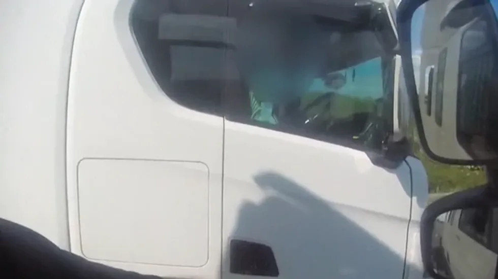 Gloucestershire Police capture a HGV driver rolling a cigarette on the M5