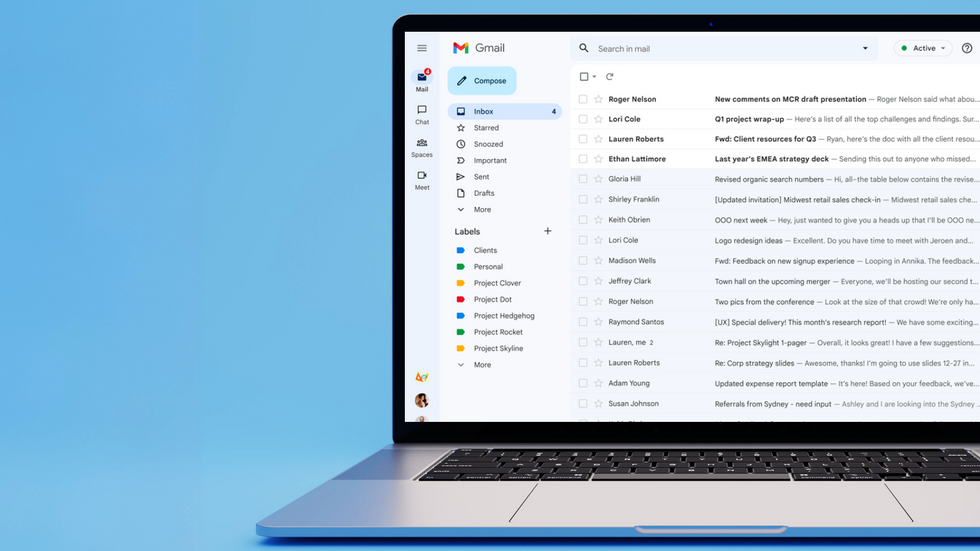 gmail inbox shown on-screen on a laptop with a blue background 