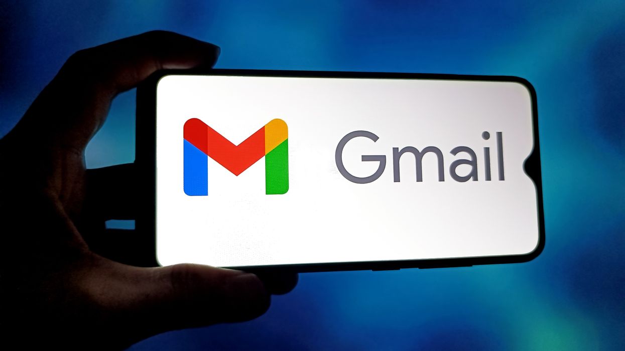 Gmail logo on smartphone with password text displayed