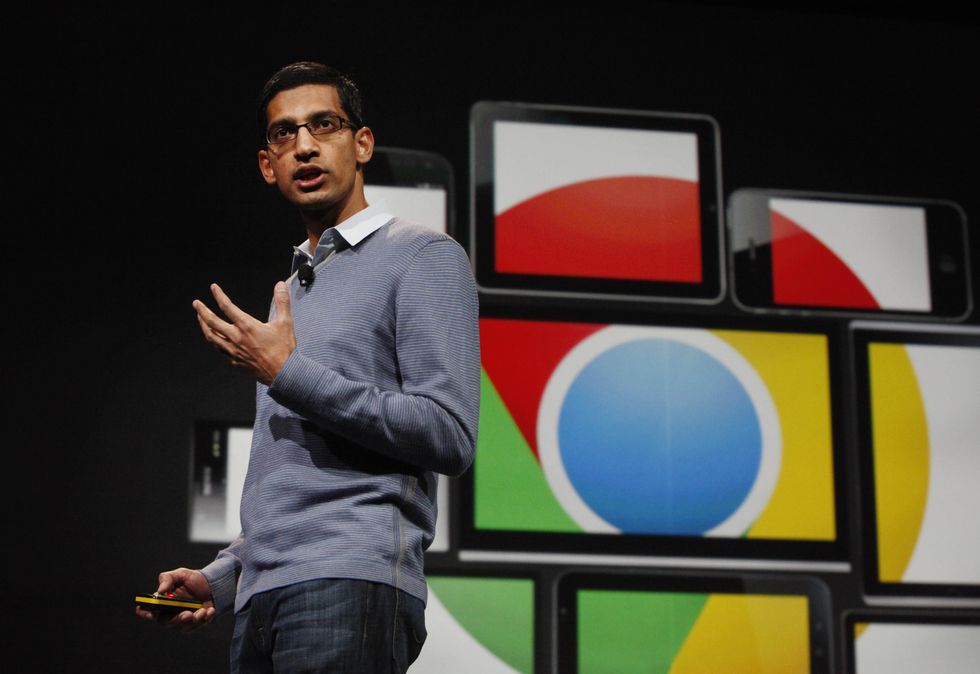 Google CEO Sundar Pichai pictured walking on-stage to discuss google web browser at google io 