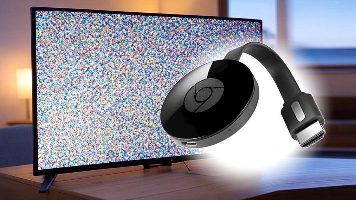 Google Chromecast pictured beside a Smart TV with static on-screen