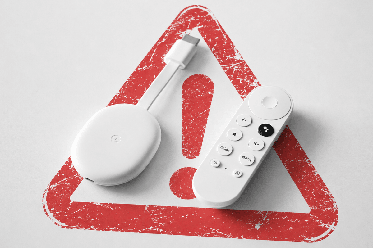 google chromecast shown on a table with a warning triangle in the background