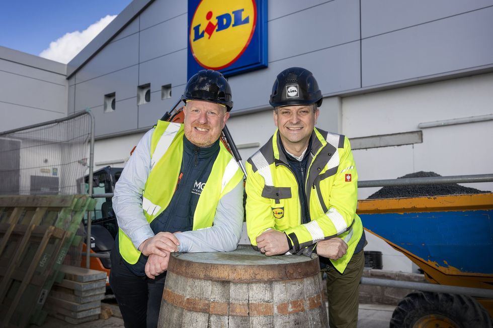 Gordon Cruikshanks and MMG contractor stood outside Lidl
