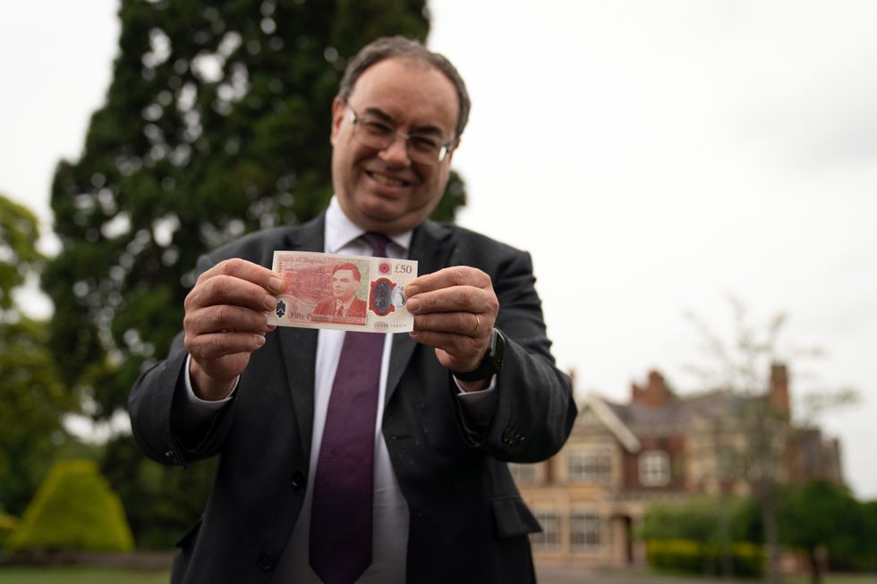 Governor of the Bank of England Andrew Bailey with the new 50 note which features Alan Turing, at Bletchley Park in Milton Keynes.