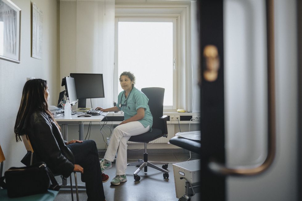 GP speaking with a patient.
