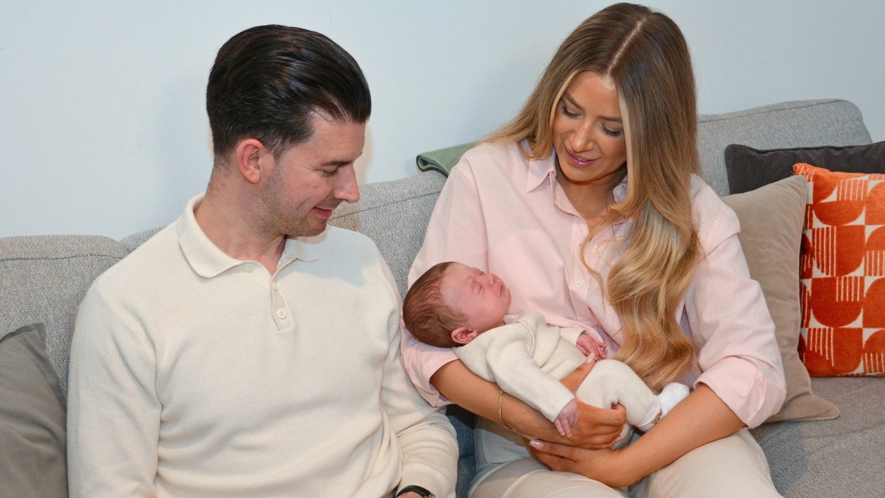 Grace Bell and Steven Powell with their baby son Hugo Powell, 