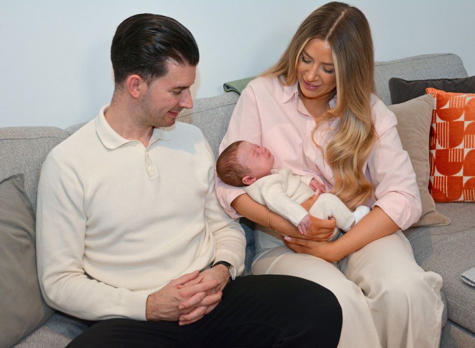 Grace Bell and Steven Powell with their baby son Hugo Powell