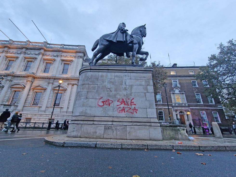 Graffiti on the Field Marshal Earl Haig Memorial following a pro-Palestine march organised by Palestine Solidarity Campaign in central London