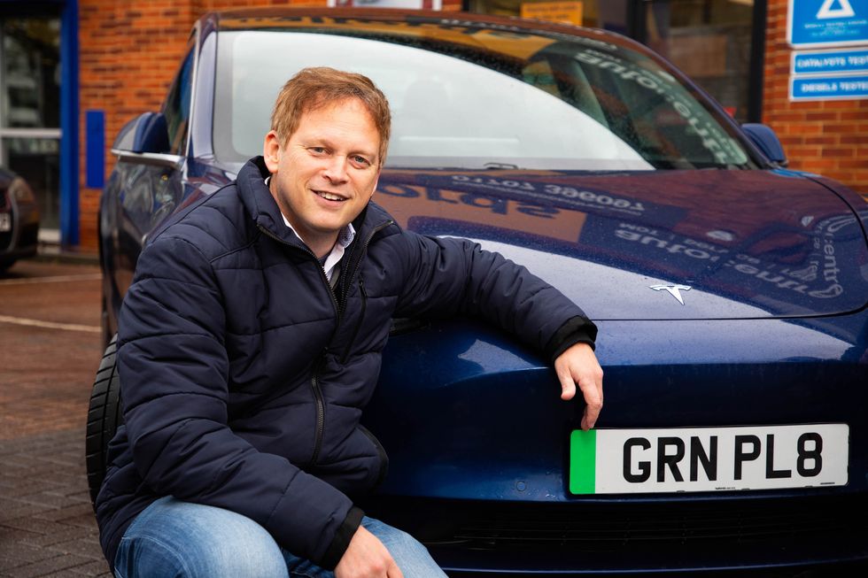 Grant Shapps with a green number plate