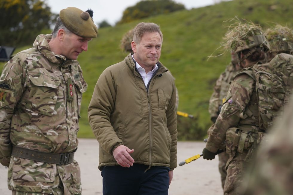 Grant Shapps with Nato troops in Poland