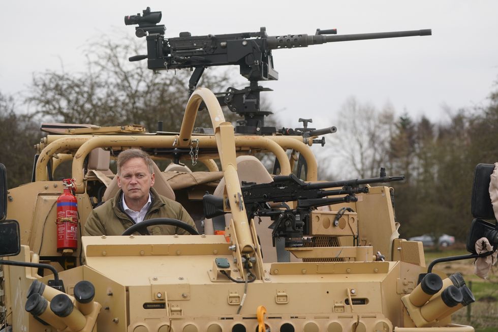 Grant Shapps with Nato troops in Poland