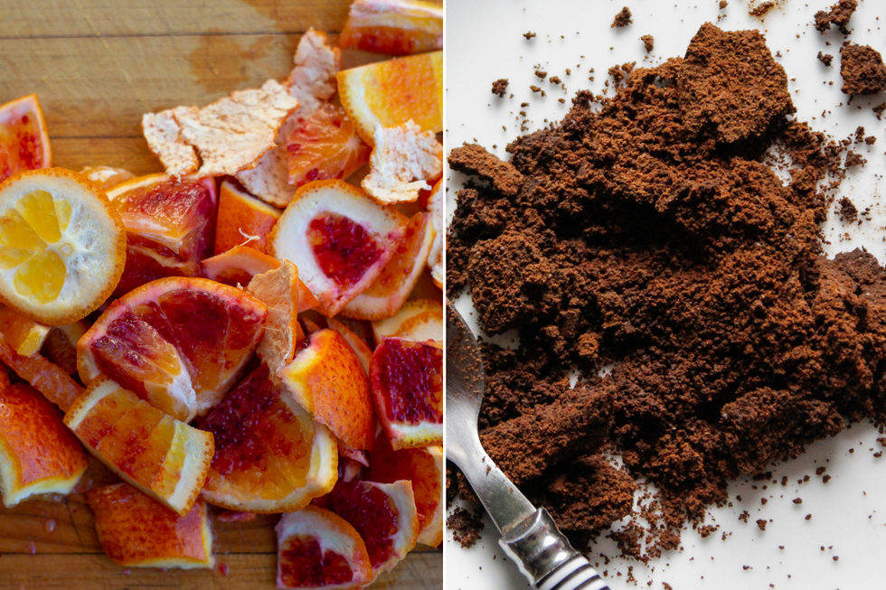 Grapefruit peels; ground coffee on white background next to a metal spoon