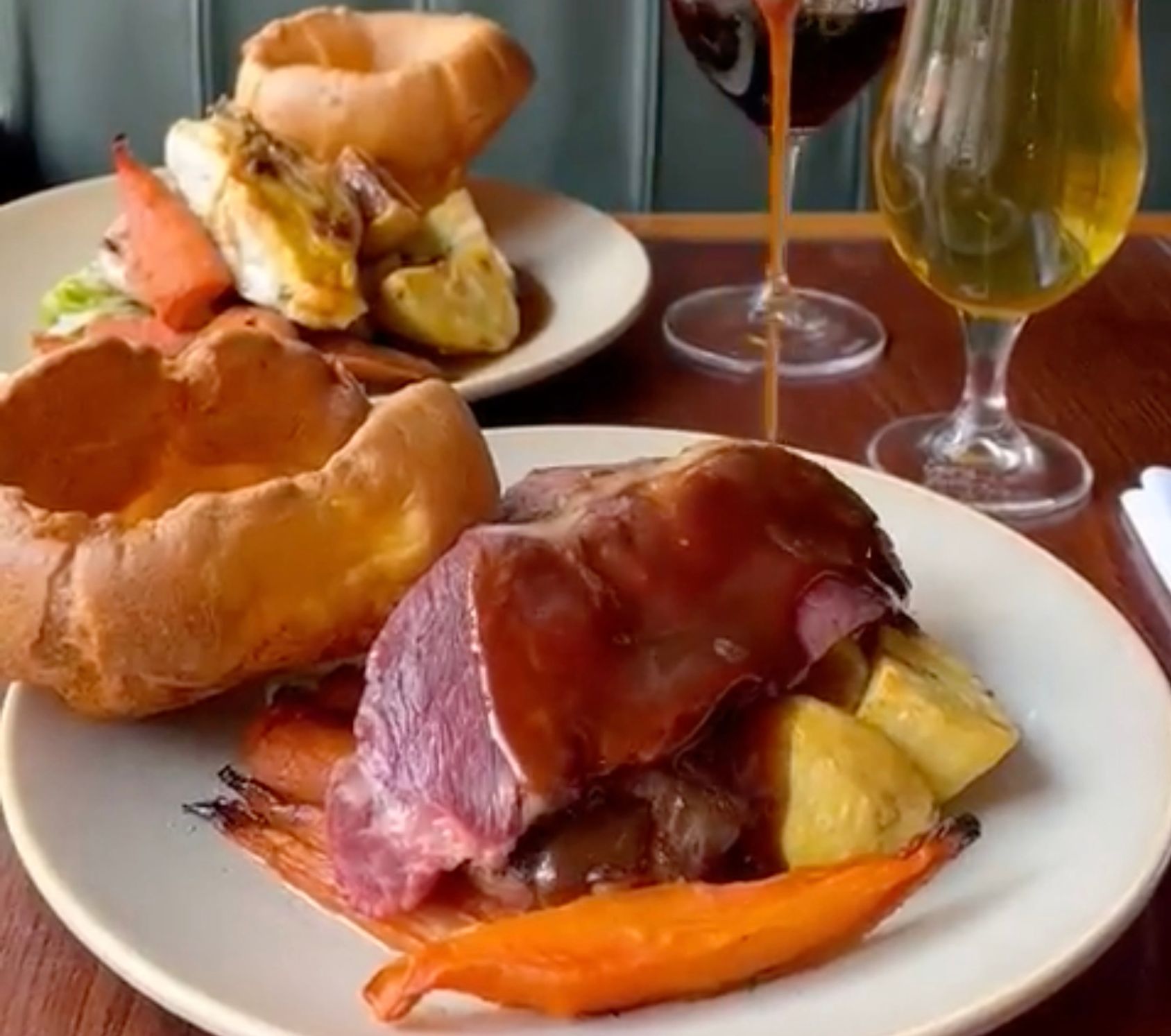 Gravy covers the very rare meat.