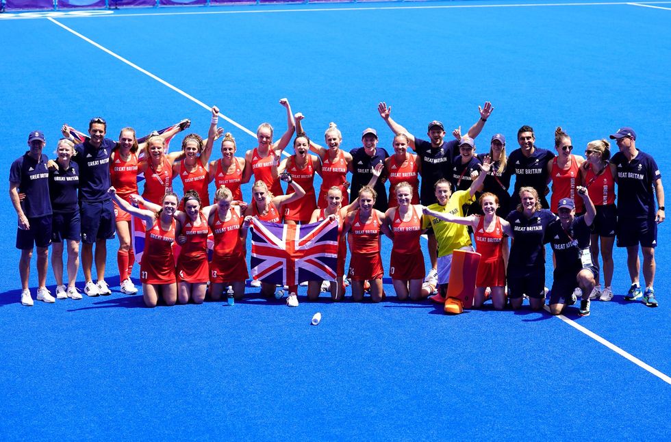Great Britain players and staff celebrate winning bronze in the Women's Bronze Medal Match at the Oi Hockey Stadium on the fourteenth day of the Tokyo 2020 Olympic Games in Japan.