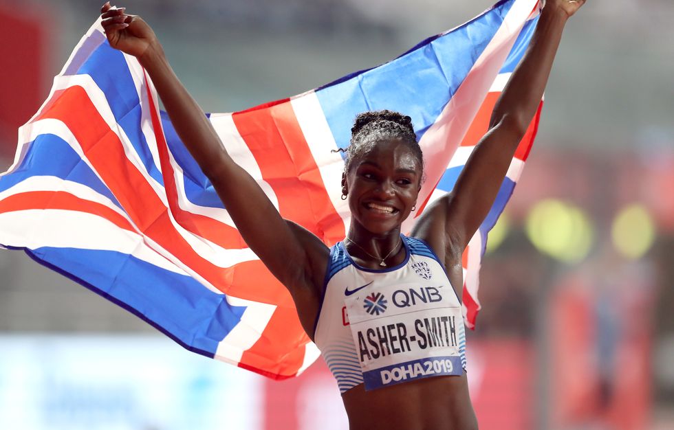 Great Britain's Dina Asher-Smith celebrates winning the Women's 200m final during day six of the IAAF World Championships at The Khalifa International Stadium, Doha, Qatar. Issue date: Friday July 9, 2021.