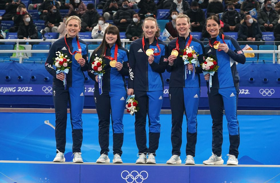 Great Britain's Mili Smith, Hailey Duff, Jennifer Dodds, Vicky Wright and Eve Muirhead celebrate with the gold medal after victory in the Women's Gold Medal Game against Japan during day sixteen of the Beijing 2022 Winter Olympic Games at the National Aquatics Centre in China.