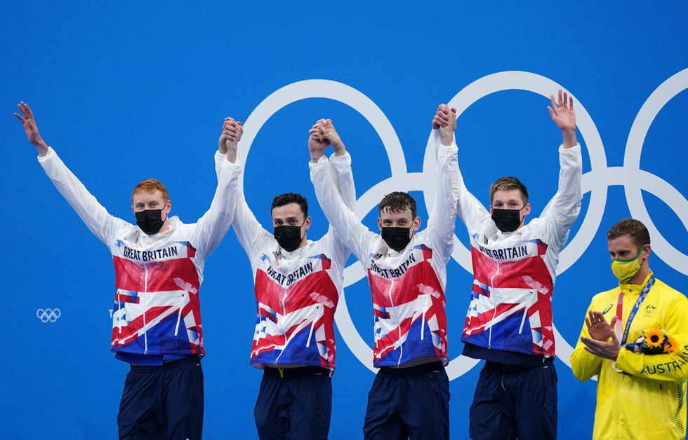Great Britain's Tom Dean, James Guy, Matthew Richards and Duncan Scott celebrate gold in the Men's 4x200 freestyle relay at Tokyo Aquatics Centre on the fifth day of the Tokyo 2020 Olympic Games.