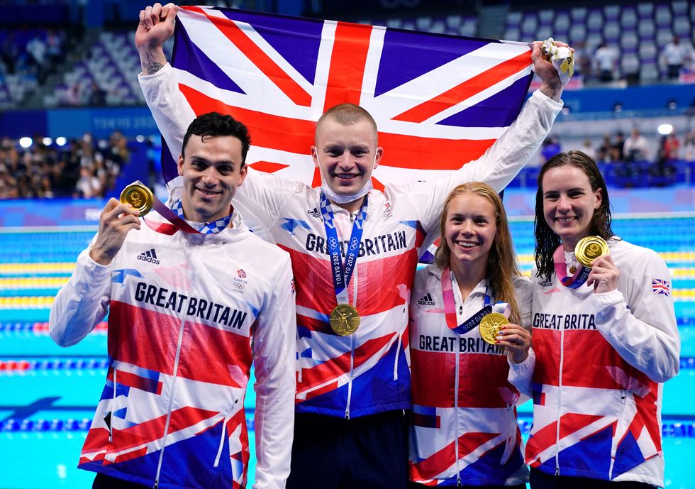 Great Britain's Adam Peaty, James Guy, Anna Hopkin and Kathleen Dawson receive their Gold medals for the Mixed 4 x 100m medley relay during the swimming at the Tokyo Aquatics Centre on the eighth day of the Tokyo 2020 Olympic Games in Japan. Picture date: Saturday July 31, 2021.
