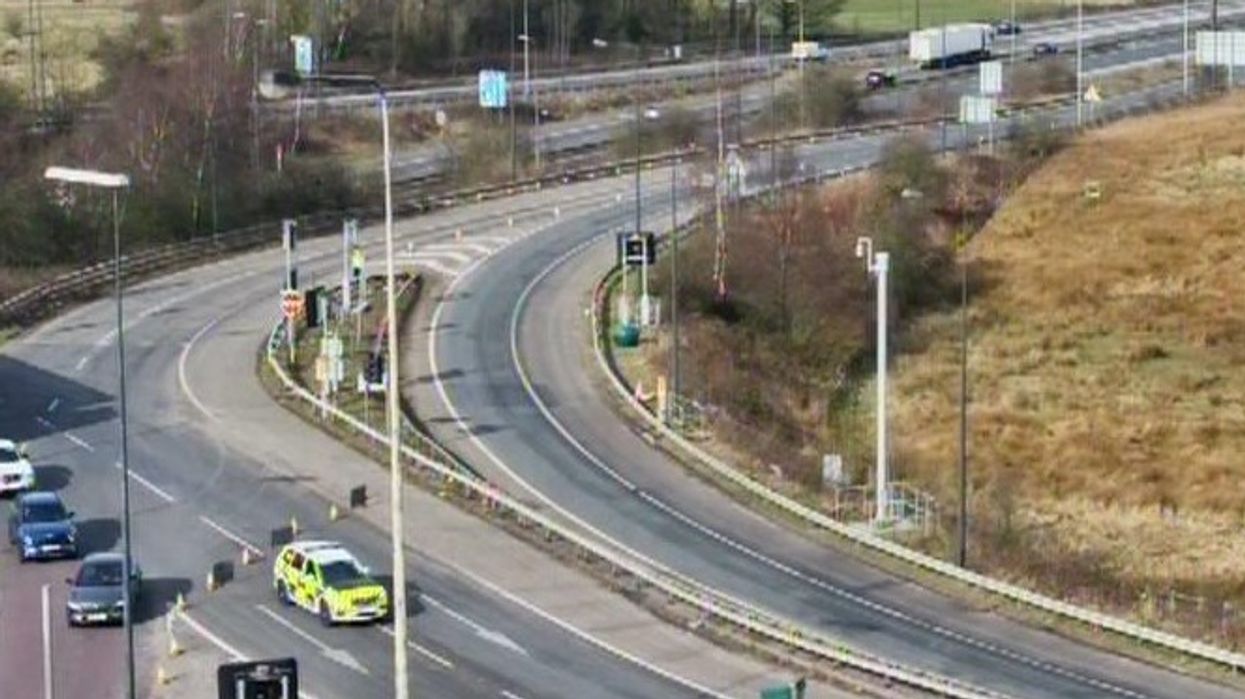 Greater Manchester Police remain in attendance on the M62