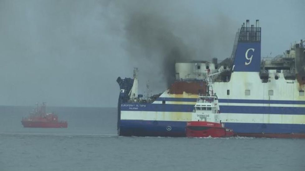 Passenger found alive on Greece-Italy ferry after blaze, 11 still missing